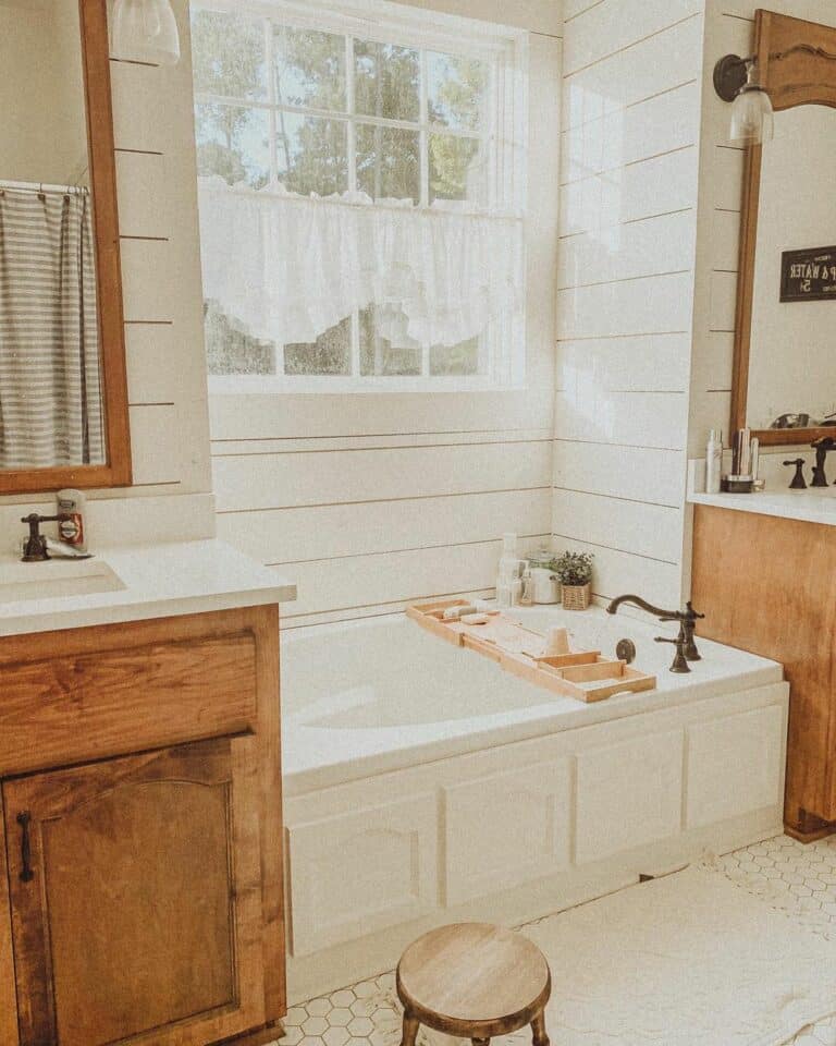 Bathtub Flanked by Matching Wood Vanities