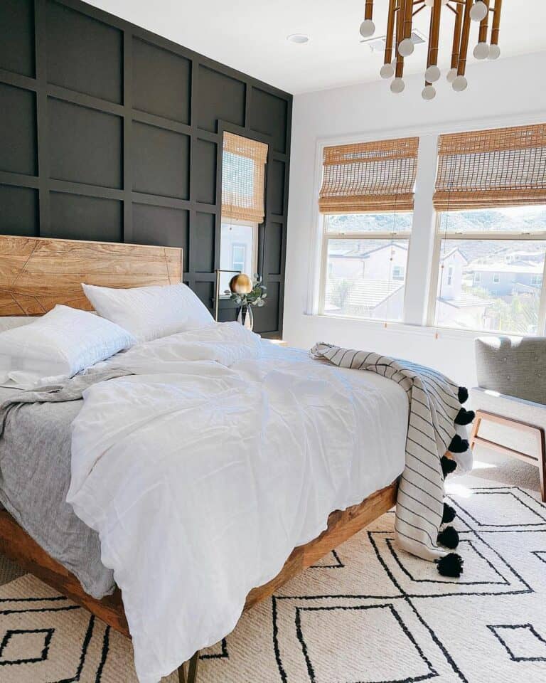 Black Accent Wall With Rattan Blinds in Bedroom