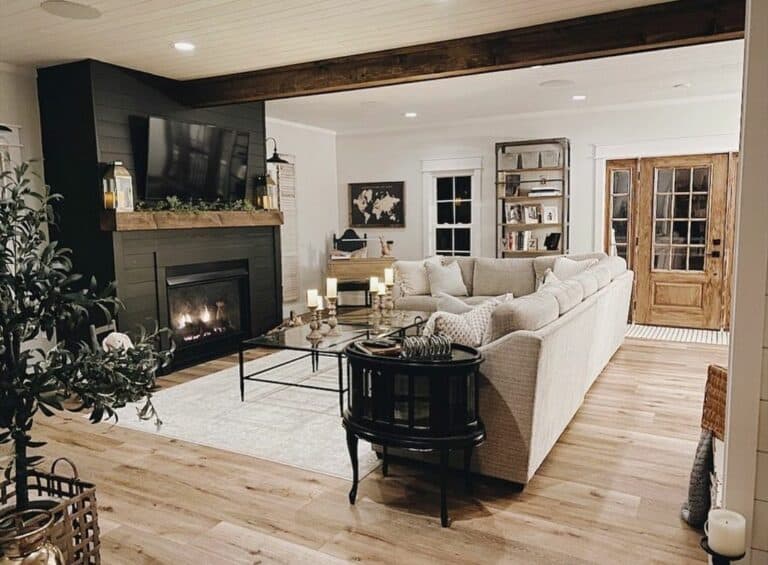 Black Shiplap Fireplace With Beige Sectional