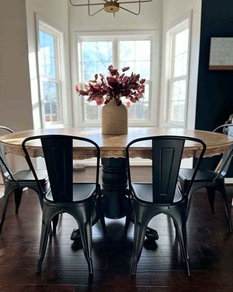 Black Wall Dining Room With Oak Flooring and Maple Table