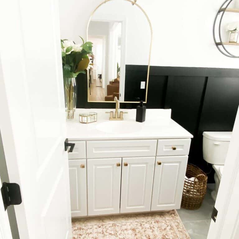 Black and White Bathroom With Brass Accessories