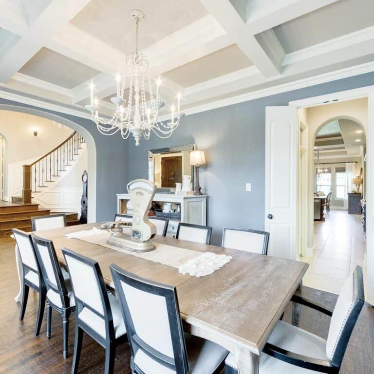 Blue Dining Room With White Chandelier