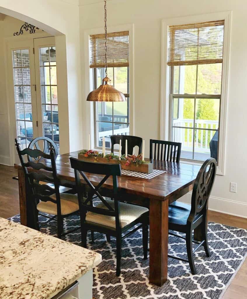 Brass Pendant Accentuates Wood Dining Table