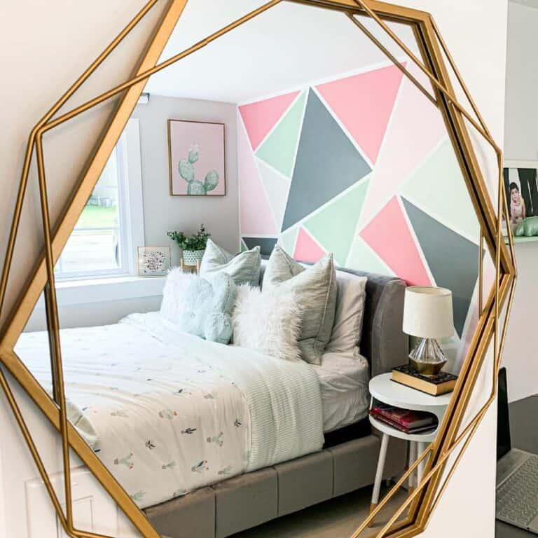 Brass-framed Mirror With Colorful Accent Wall in Bedroom