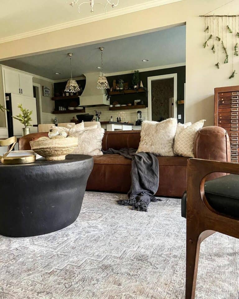 Brown Leather Sofa With Black Drum Coffee Table