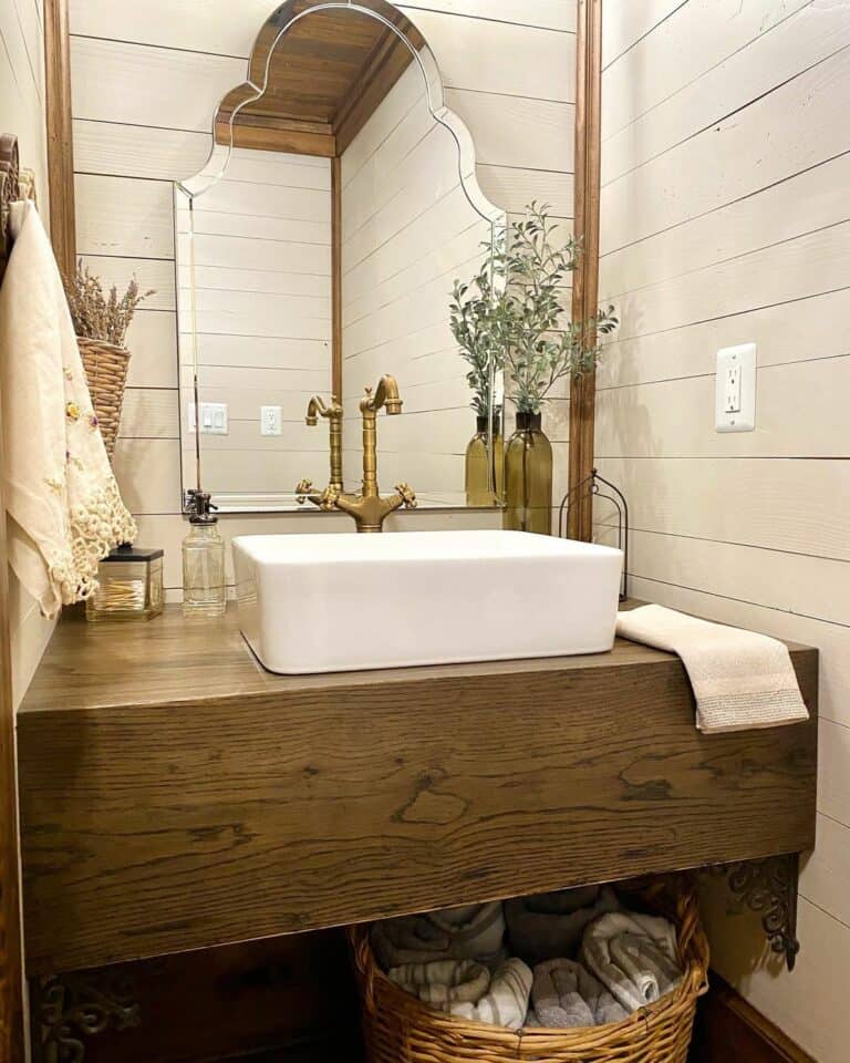 Charming Farmhouse Bathroom With Antique Wood Vanity
