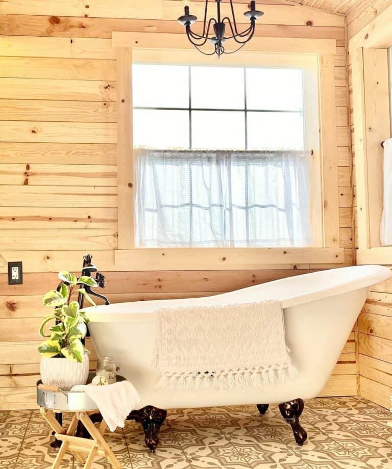 Cozy Wood Cabin Bathroom With a Vintage Freestanding Bath