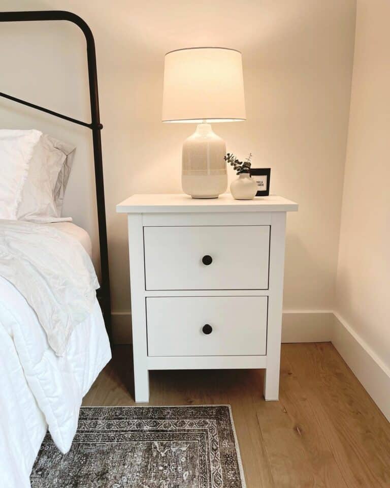 Cream Walls and White Nightstand in Bedroom