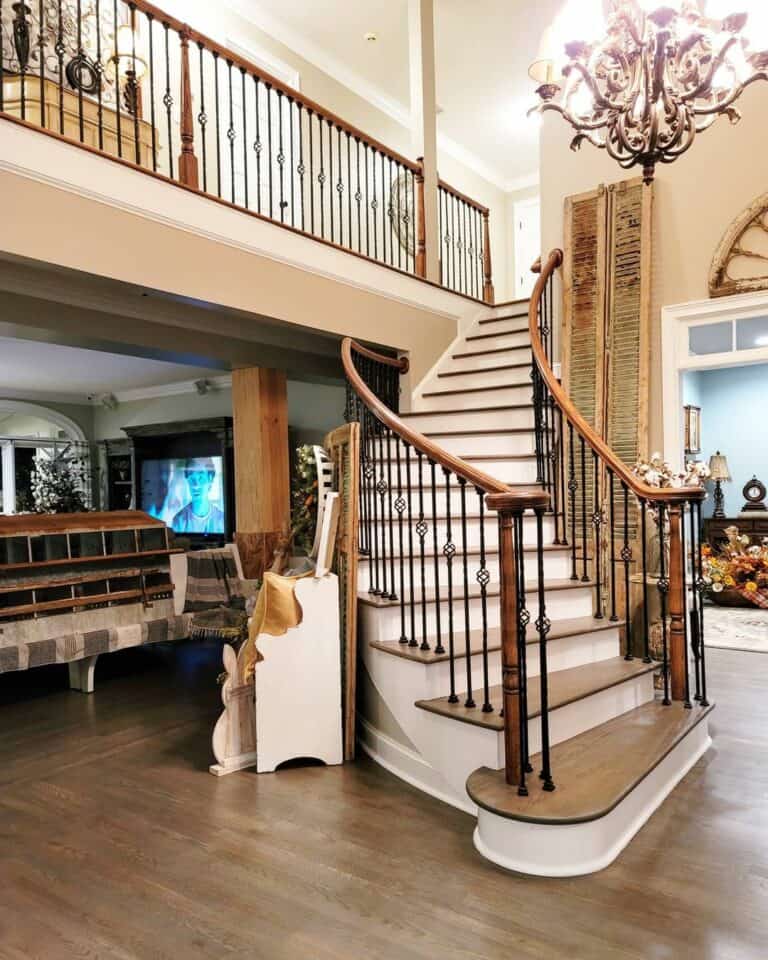 Curved Staircase With Black Wrought Iron Spindles