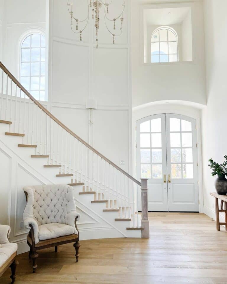 Curved Stairway With White Decorative Molding