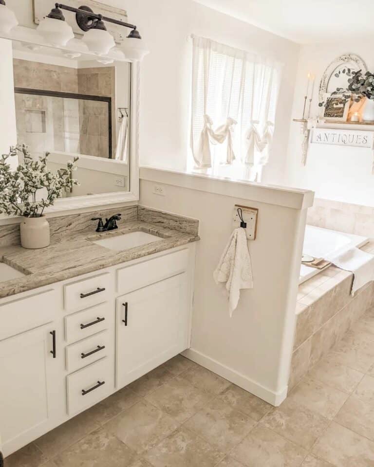 Dual Bathroom Vanity and Soaking Tub With a Partition
