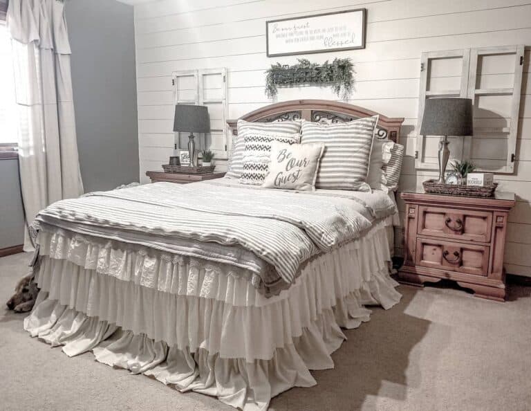 Farmhouse Bedroom With White and Gray Bed