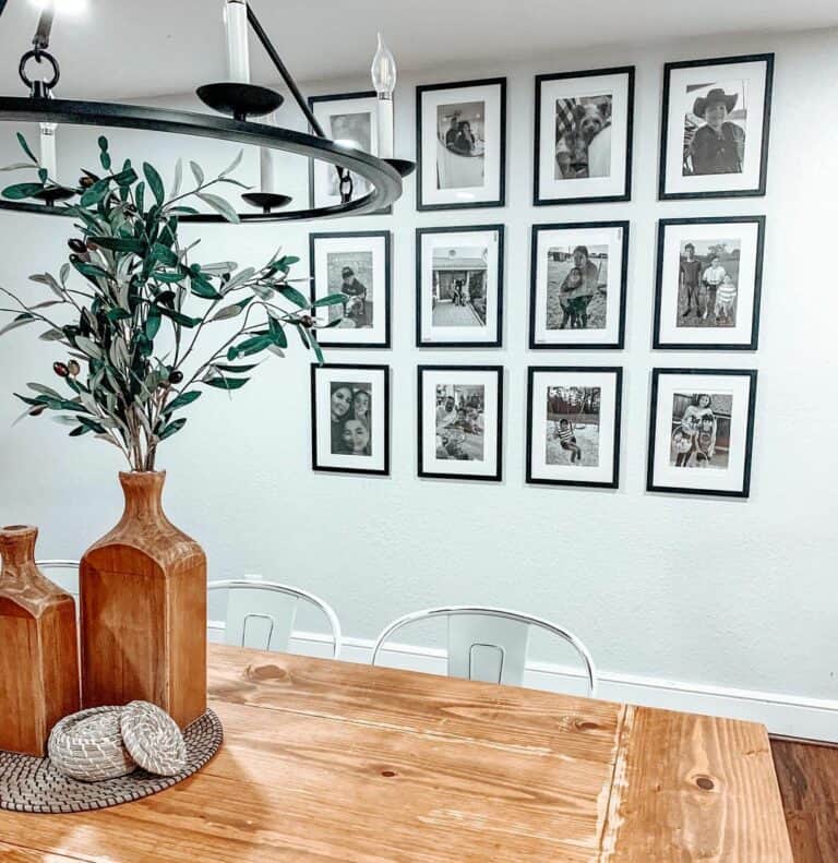 Farmhouse Dining Room With Framed Photographs