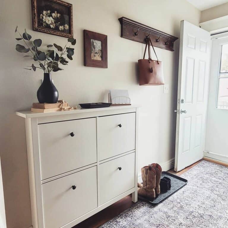 Farmhouse Entrance With White Shoe Cabinet