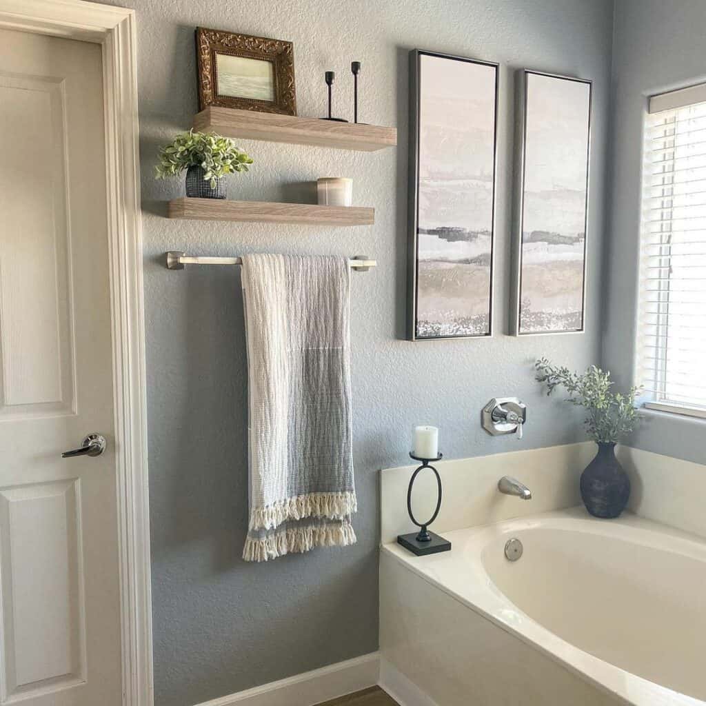 Gray Bathroom Displays Matching Artwork