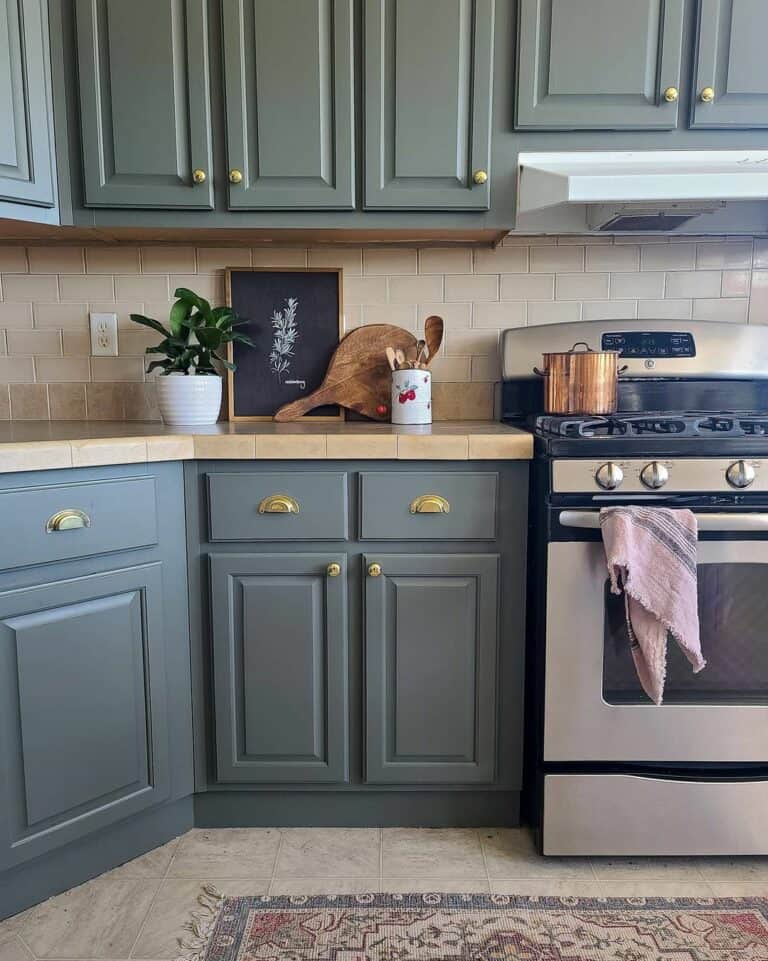 Gray Cabinets Embellished With Brass Hardware