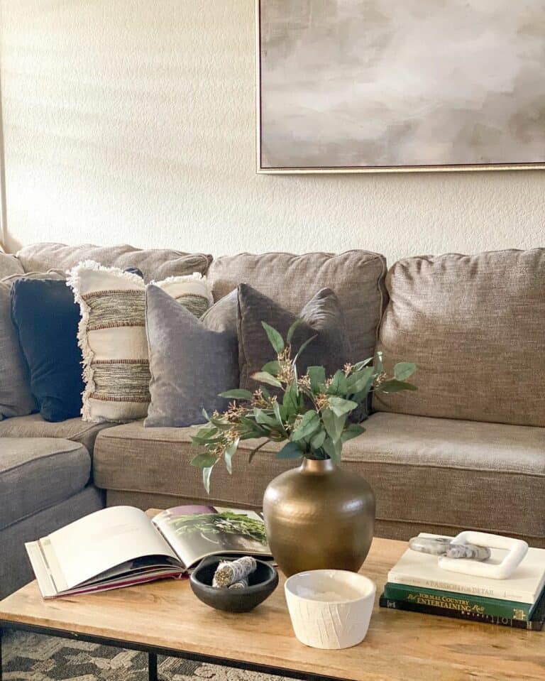 Gray Couch and Neutral Artpiece in Living Room
