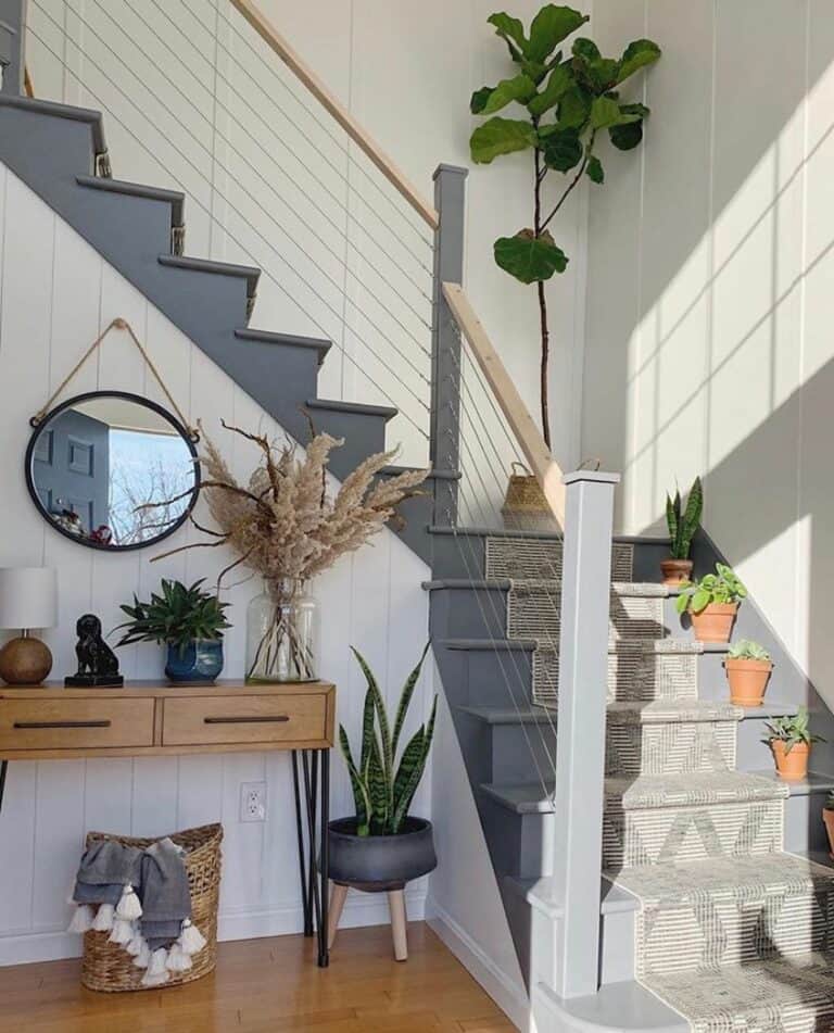 Gray Entryway Staircase With Cable Railing