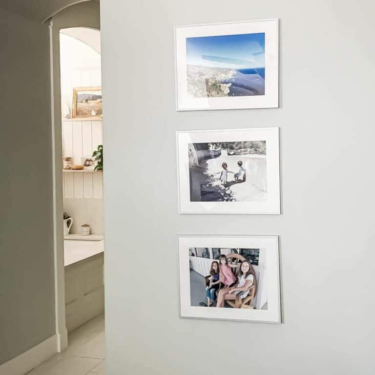 Gray Hallway With White Frame Photos