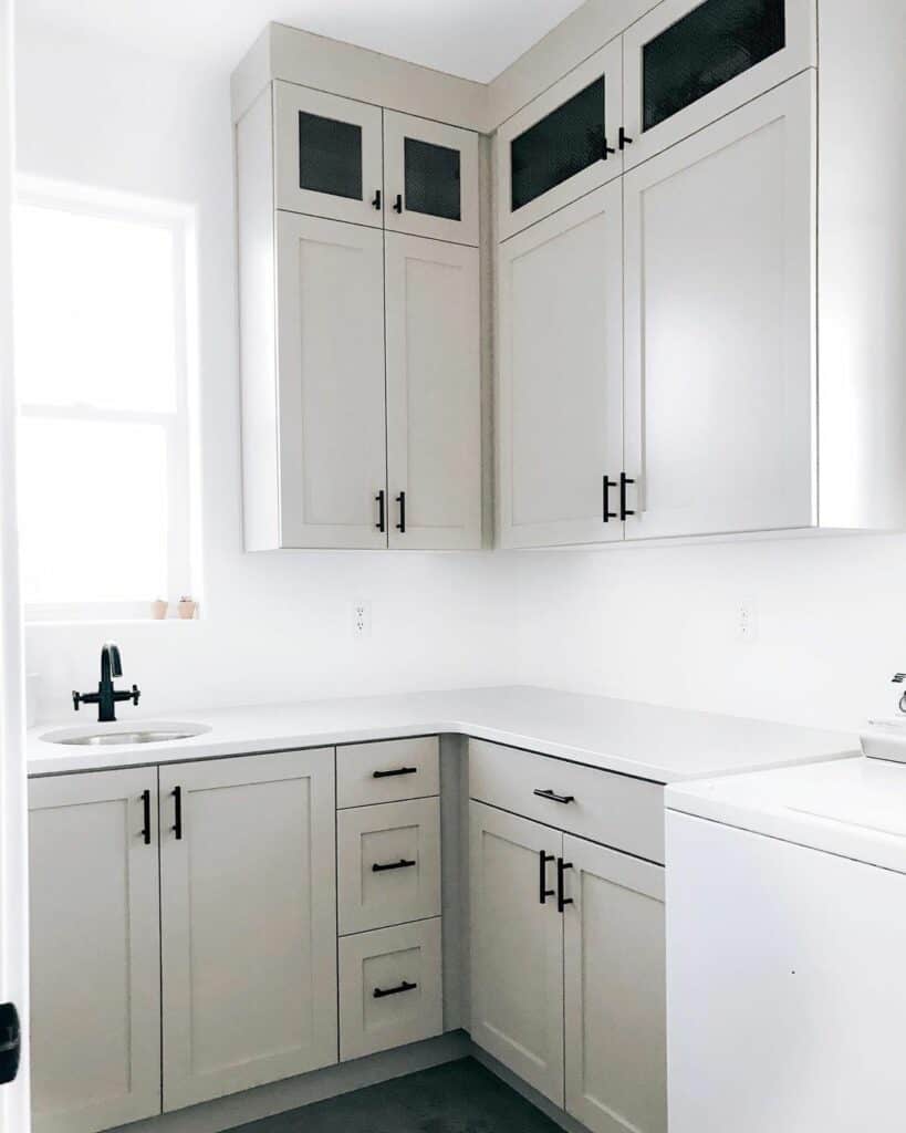 Laundry Room With Beige Cabinets