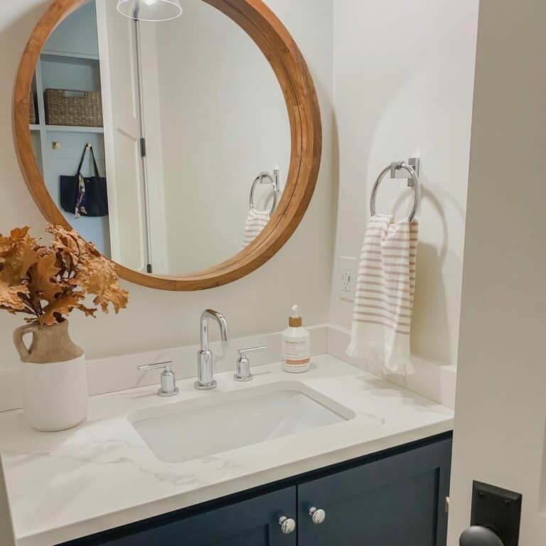 Maple Framed Mirror and Navy Blue Vanity Cabinets