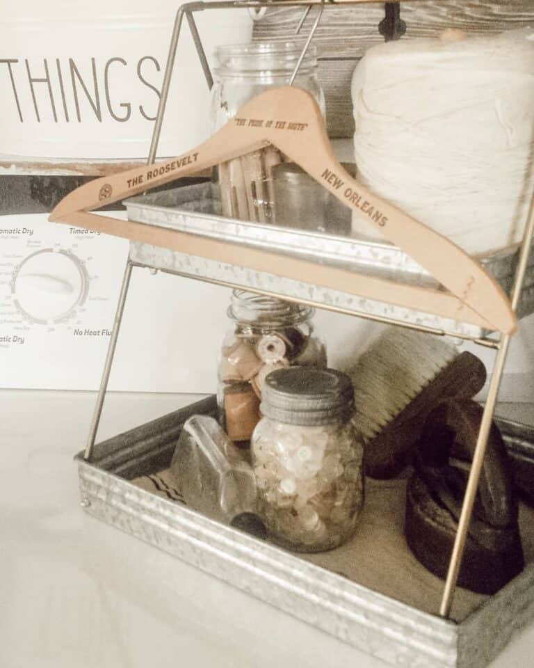 Metal Stand With Vintage Décor in Laundry Room