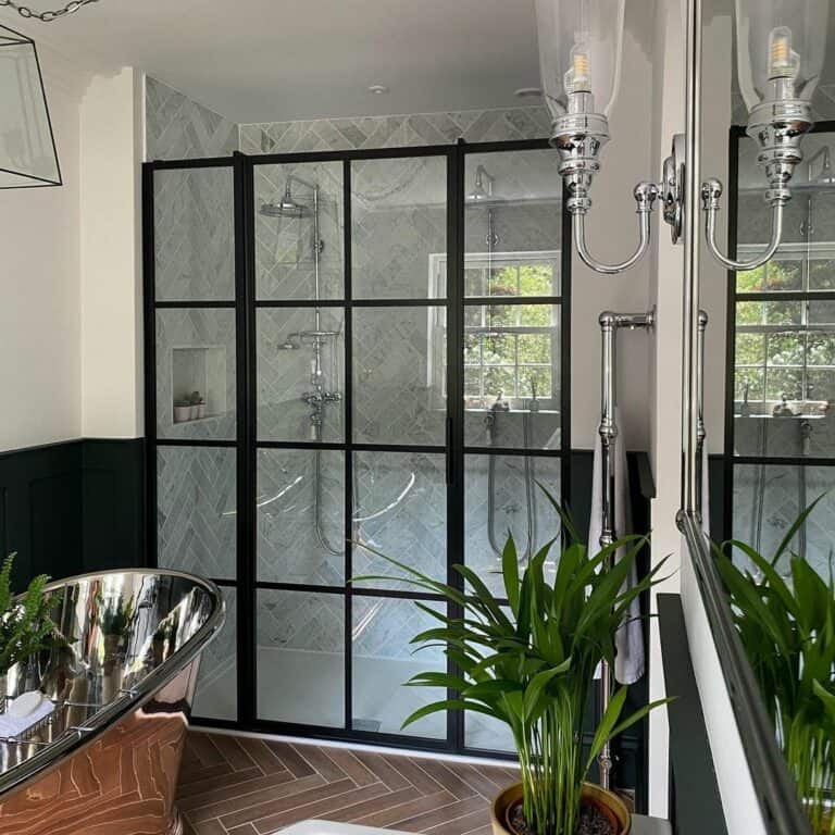 Mirrored Chrome Tub and a Black Framed Couples Shower