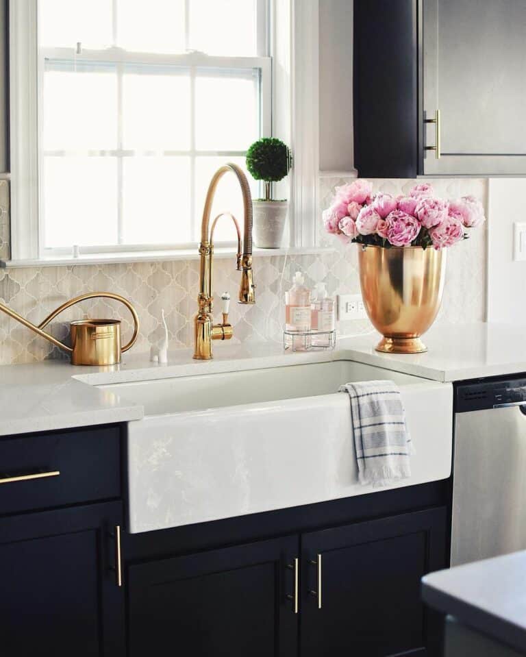 Modern Black and White Kitchen With Golden Faucet