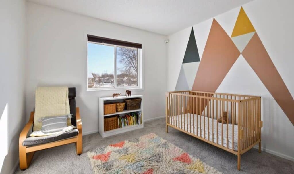 Nursery With Colorful Geometric Feature Wall
