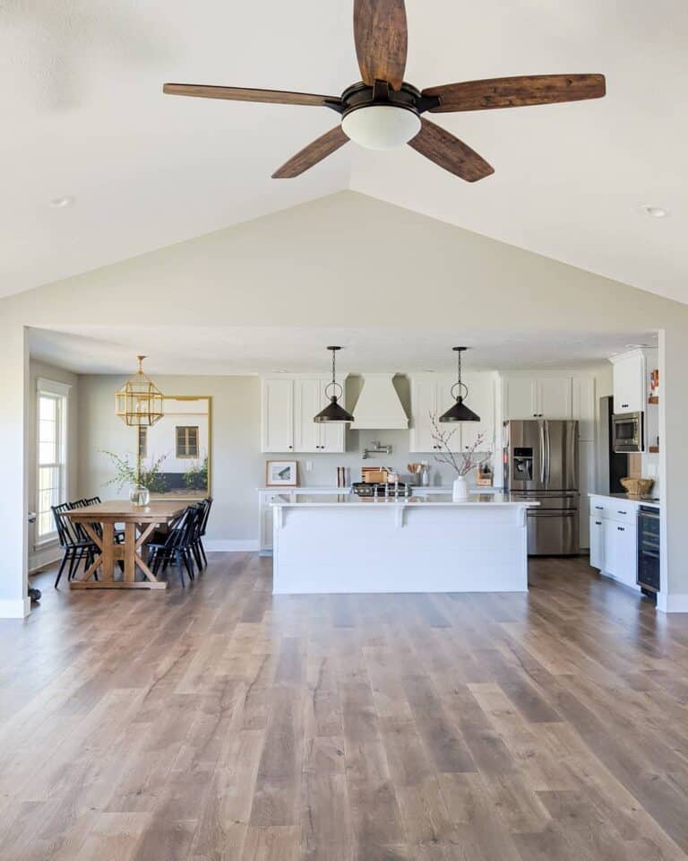 Open Concept Living Space With White Kitchen