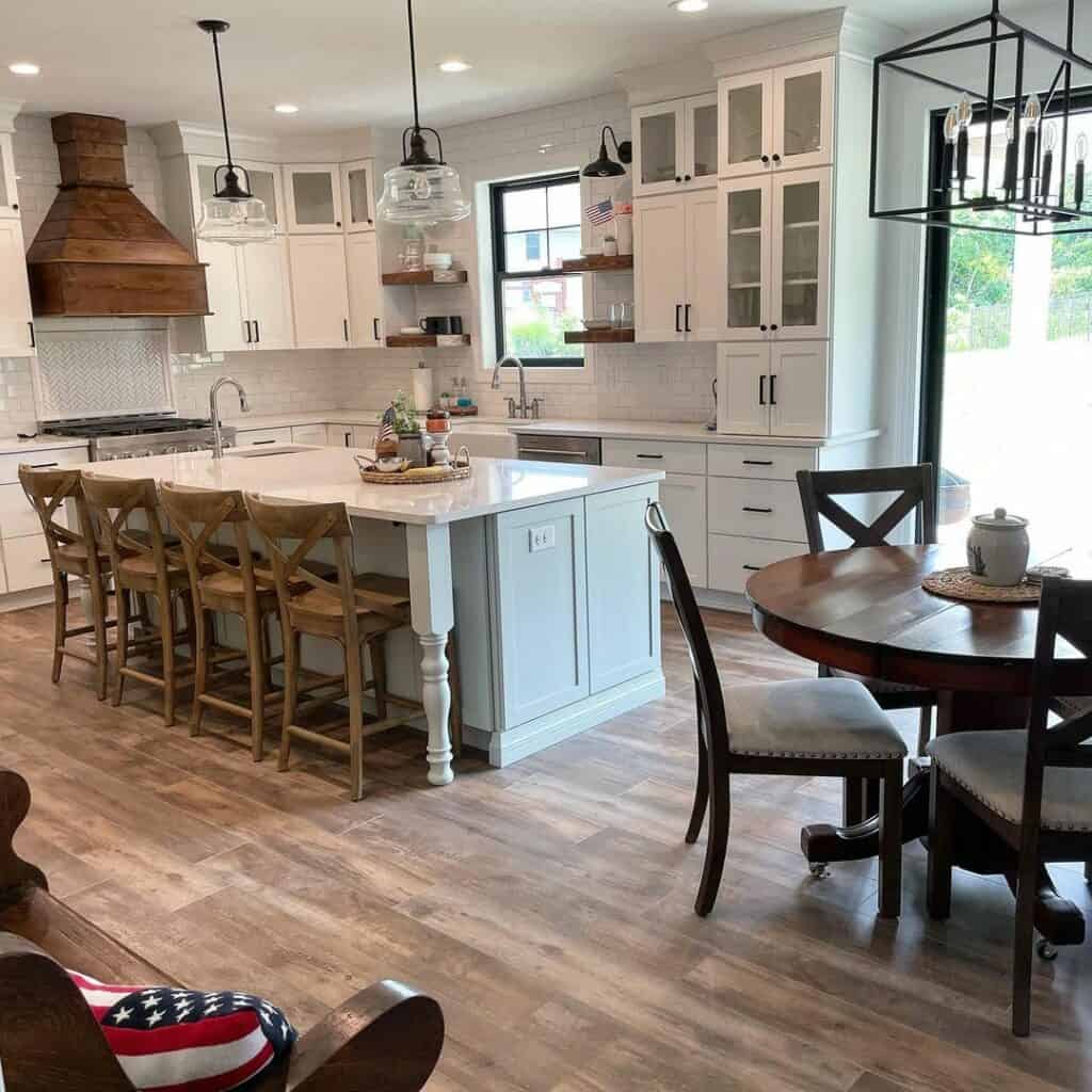 Open Kitchen Concept With Round Wood Dining Table