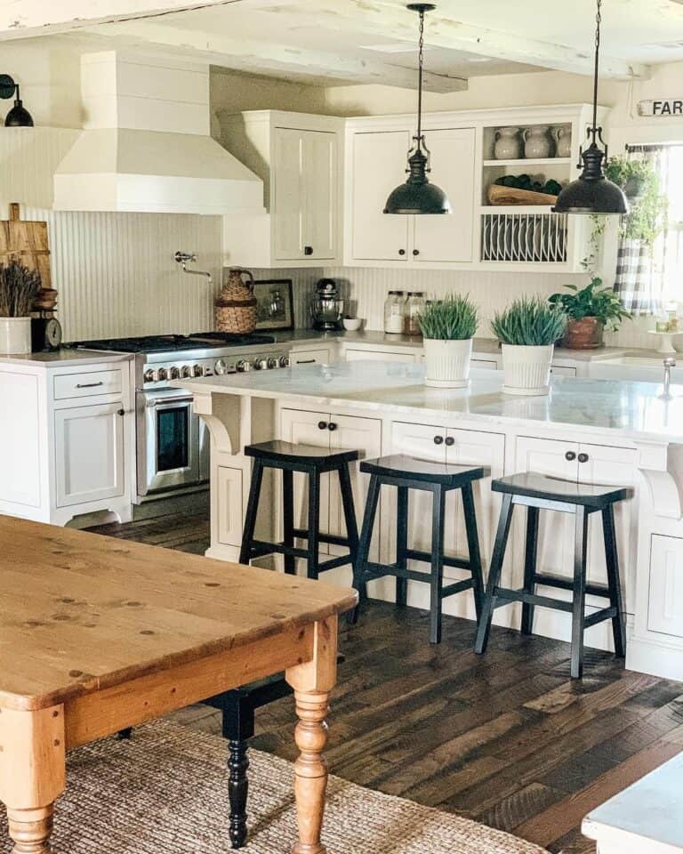 Open-concept Kitchen With Black Bar Stools