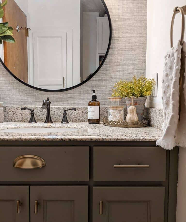Painted Vanity With Round Mirror and Textured Wall Paper
