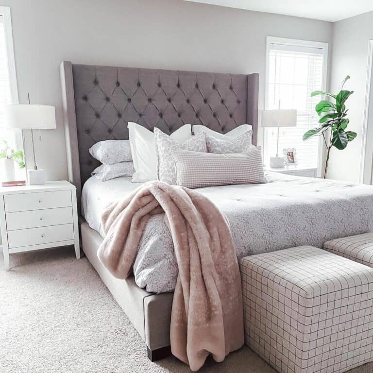 Pillowy Gray Headboard and White Nightstands in Bedroom