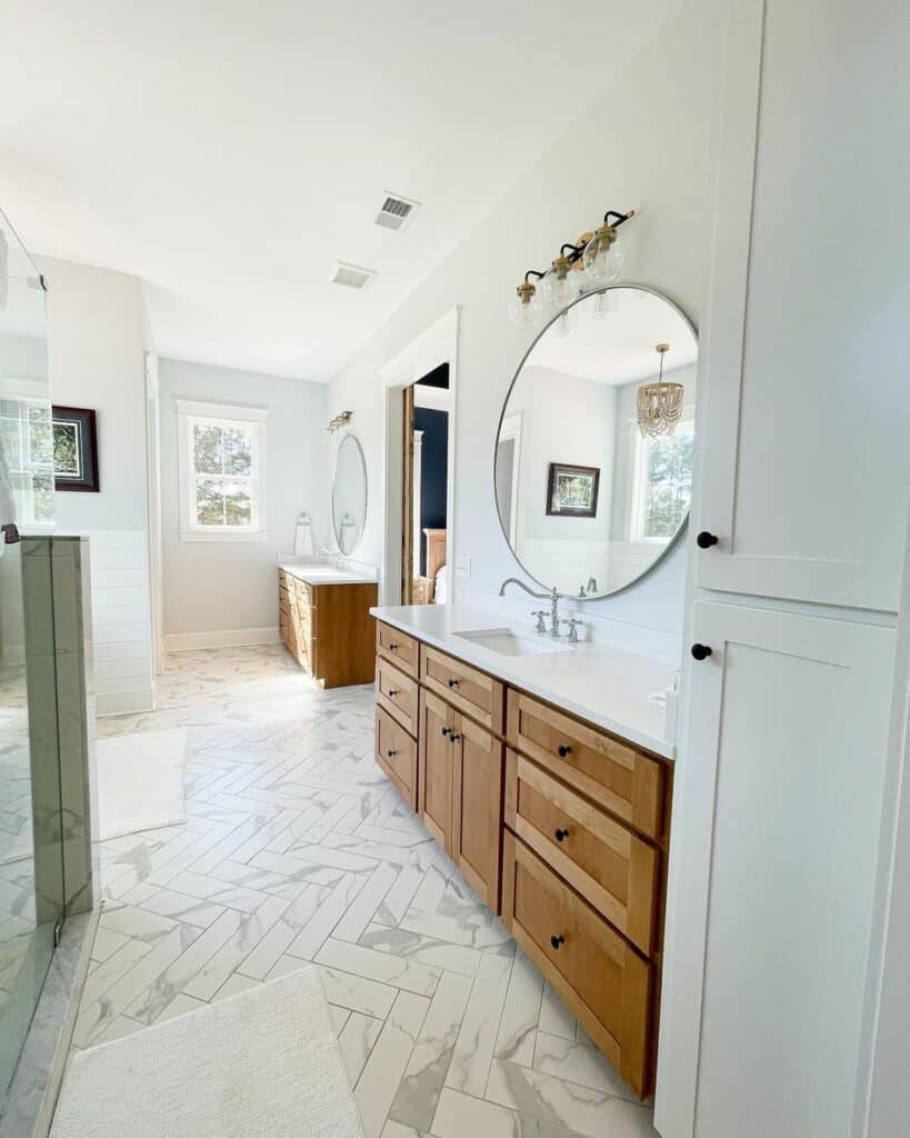 Primary Bath With Marble Herringbone Tile Flooring