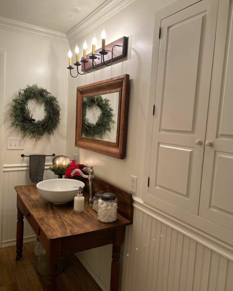 Rustic Bathroom With Wainscoting and Vintage Lighting