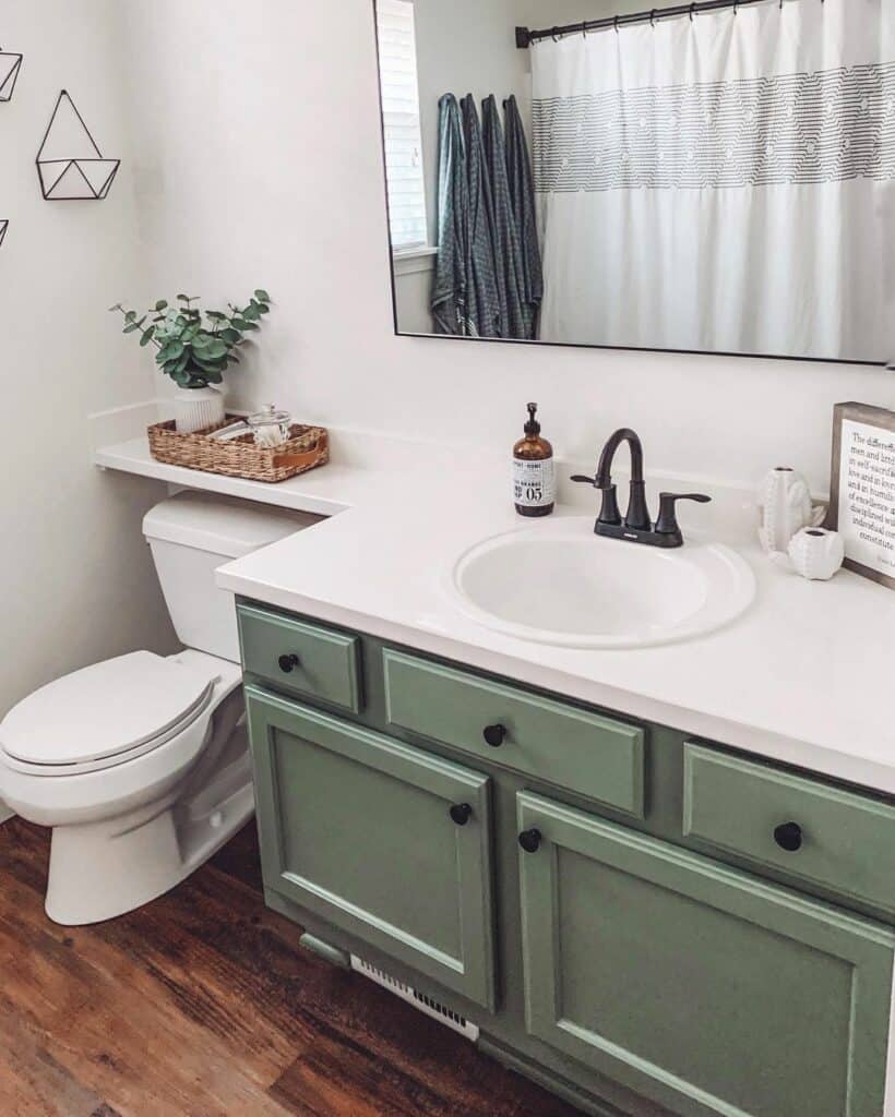 Sage Green Cabinets and Natural Wood Flooring