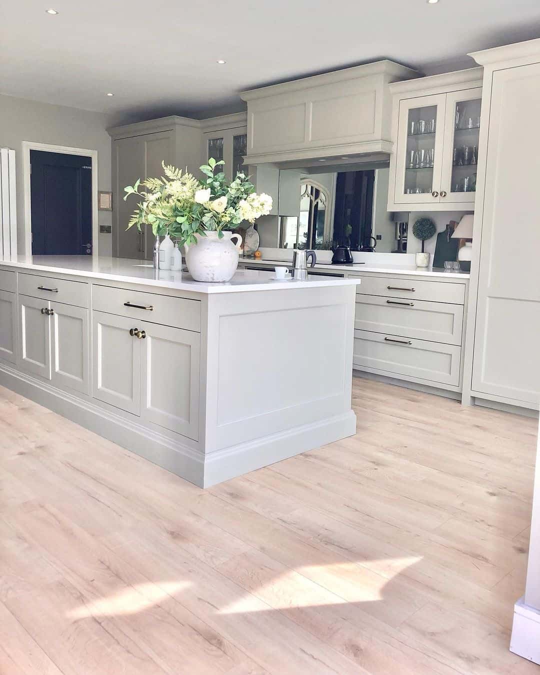 Spacious Kitchen With Beige Cabinets - Soul & Lane