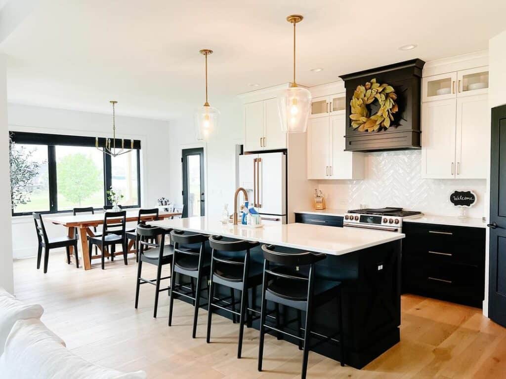 Spacious Kitchen With Black and White Island