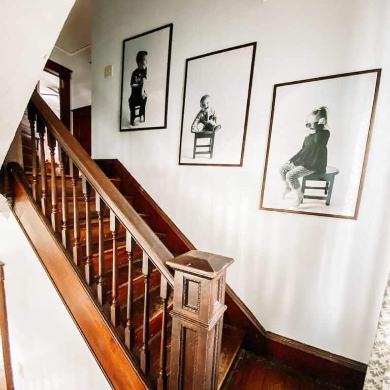 Stained Wood Staircase With Family Picture Gallery