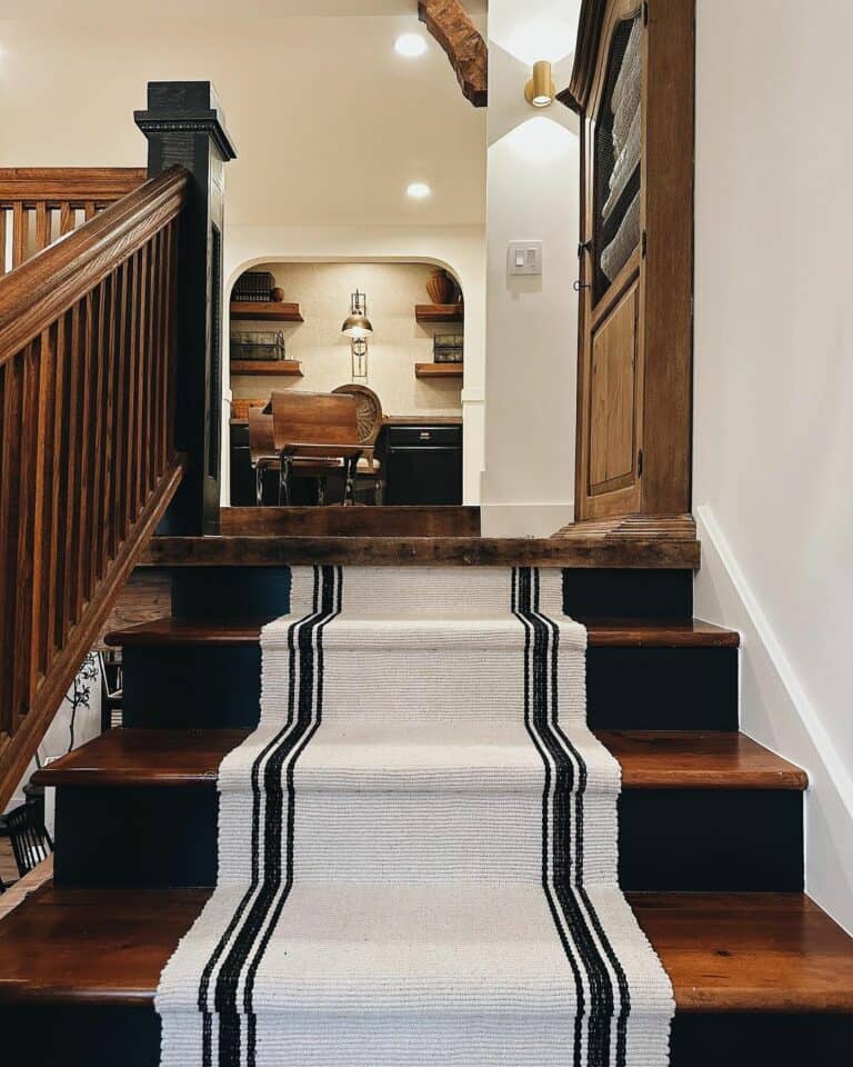 Stained Wood Staircase With White and Black Runner