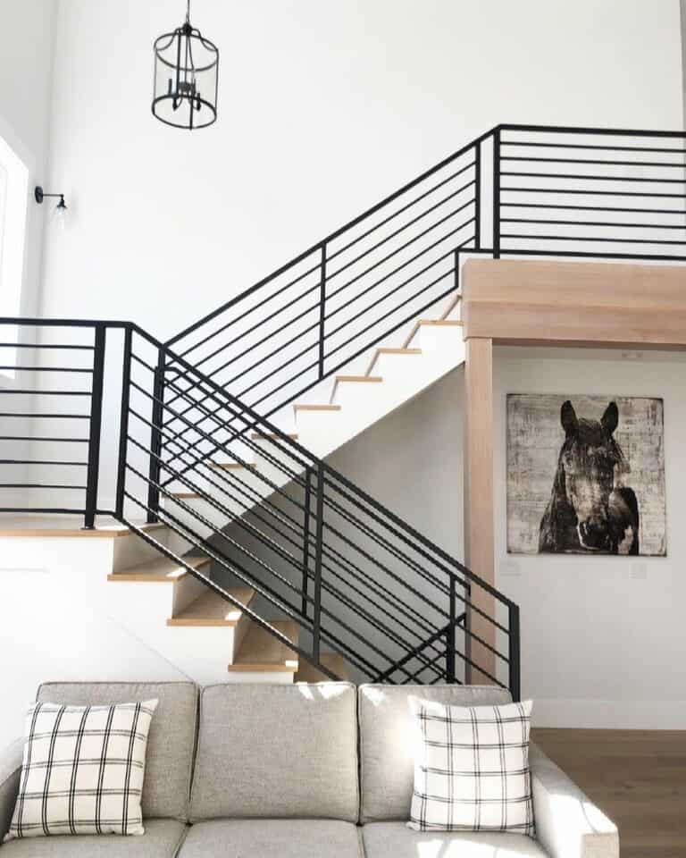 Two-toned Stairwell With Black Horizontal Railing