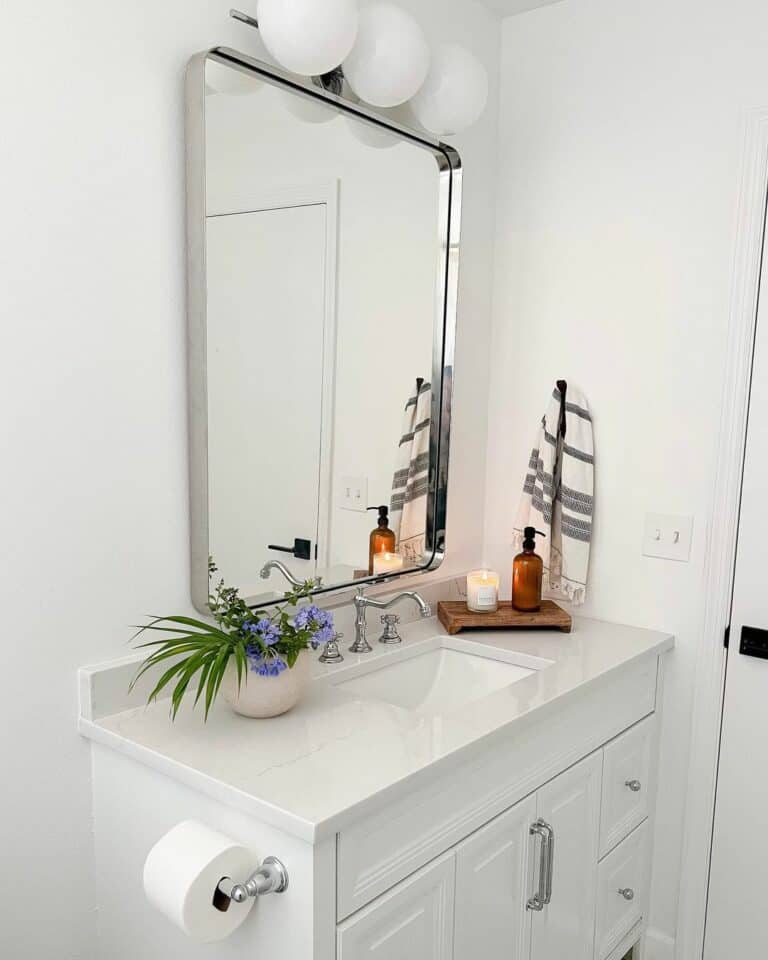 White Bathroom With Purple Flowers