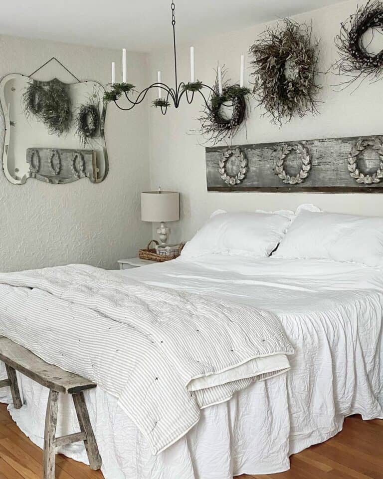 White Bedding Accompanies Heavily Decorated Walls