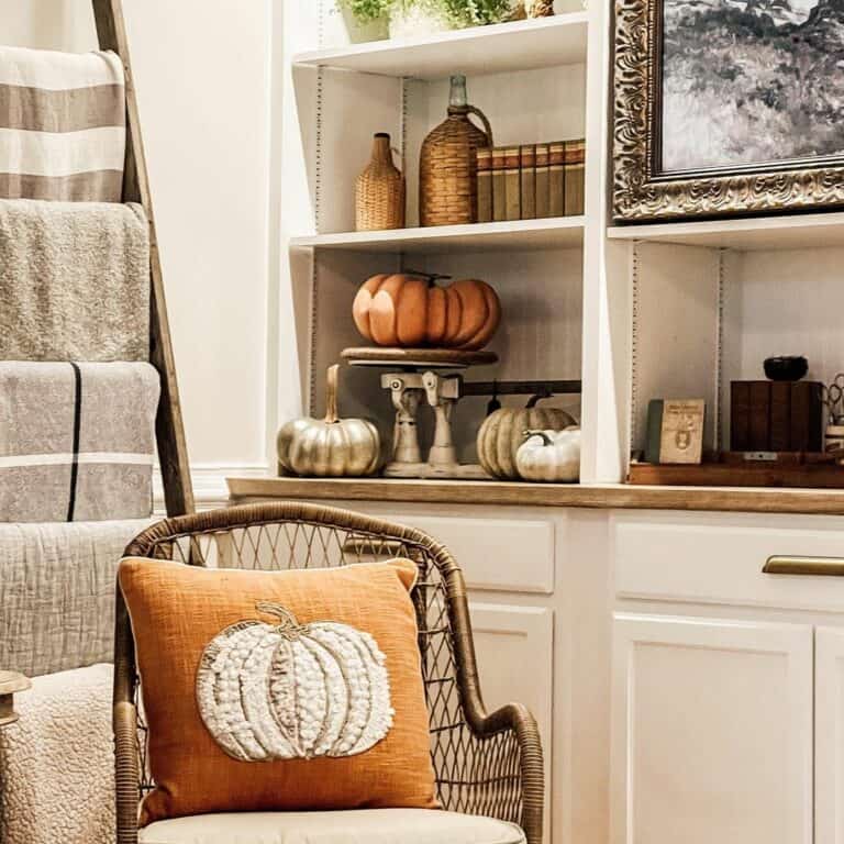 White Built-in Shelves With Pumpkin Decorations