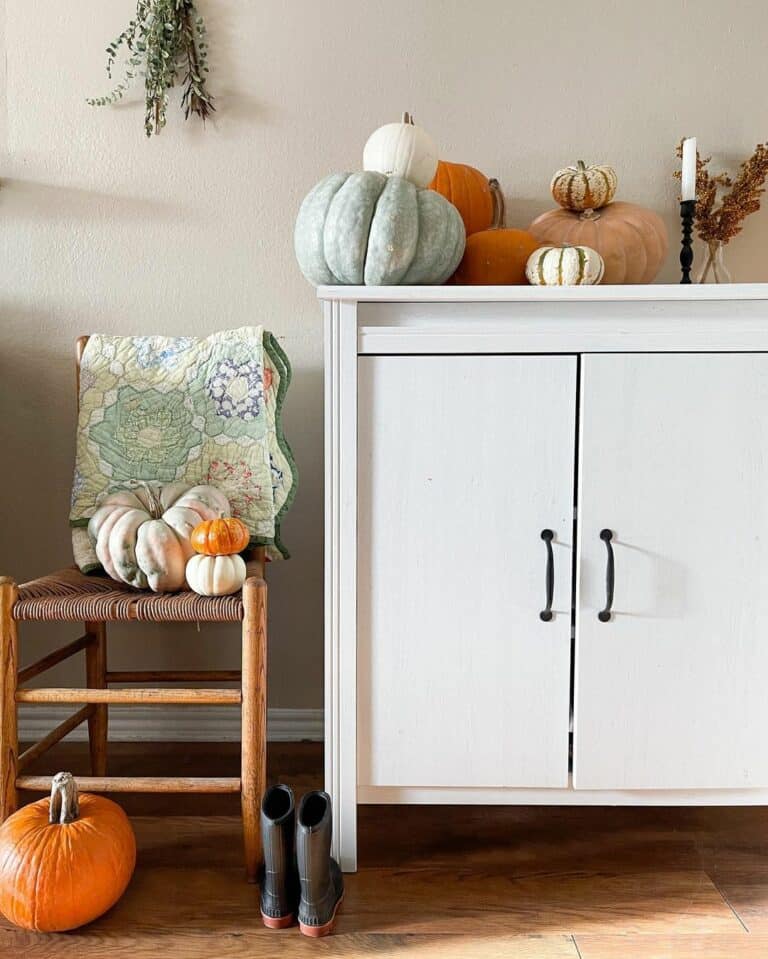 White Cabinet With Autumn Pumpkin Décor