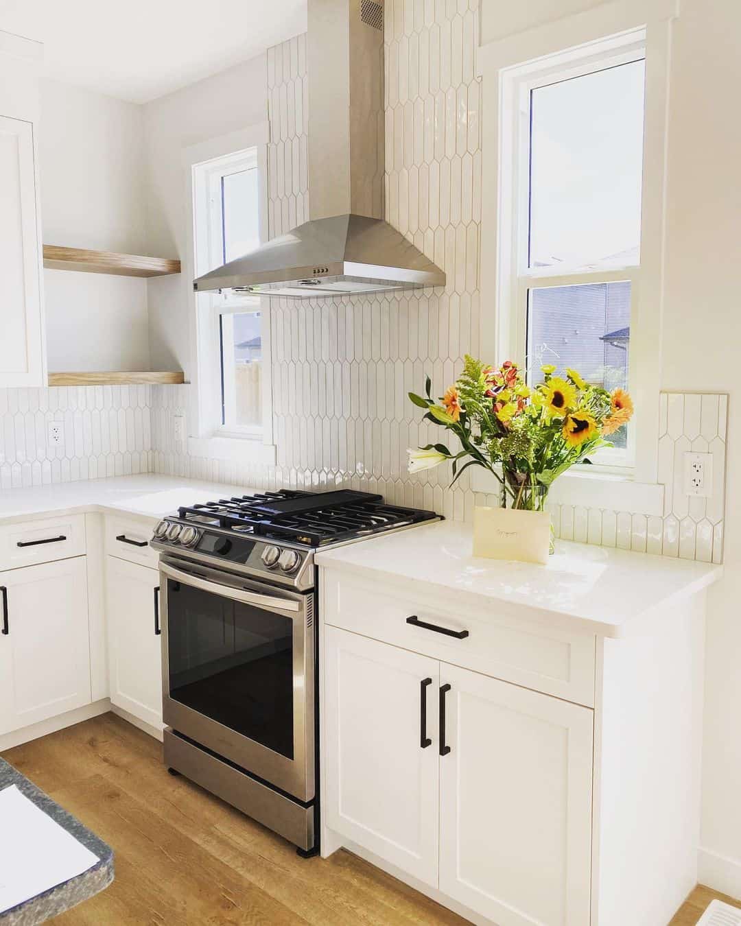 White cabinets with elongated hexagon tile backsplash soul lane
