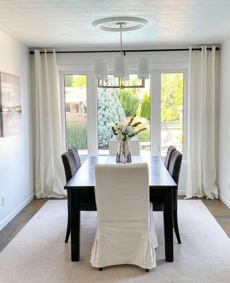 White Dining Room With Black Table
