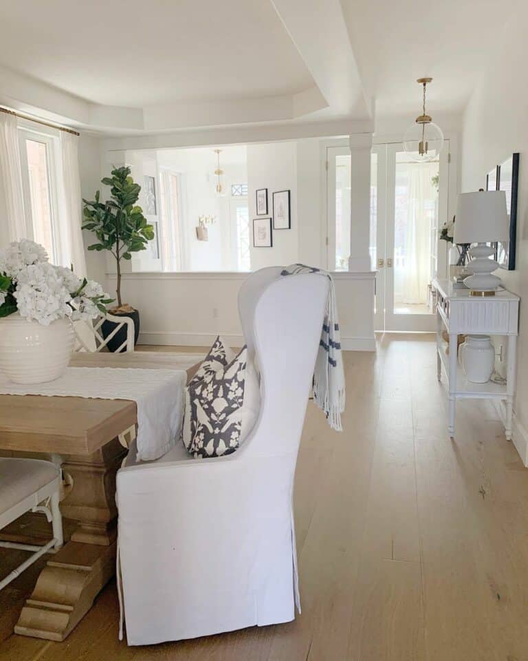 White Farmhouse Dining Room With Upholstered Chairs