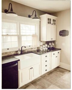 White Farmhouse Kitchen With Black Countertop